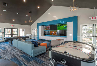 Well-decorated resident clubhouse with air hockey and billiards at Slate Creek Apartments in Roseville, California