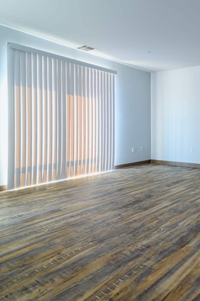 Living room space with balcony at Marketplace in Flint, Michigan