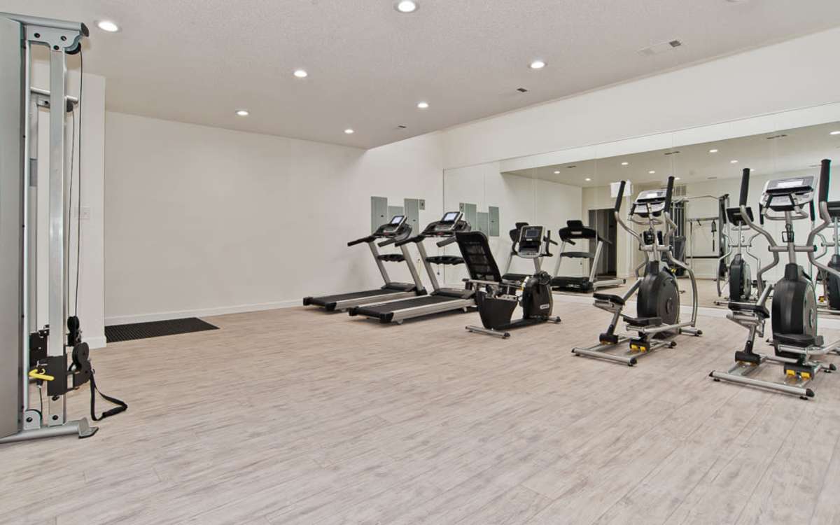 Fitness center at Oakwood Condos Bedford in Bedford, Texas