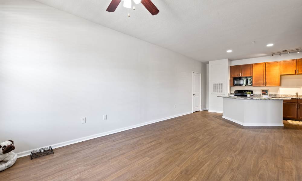 Renovated living room adjacent to kitchen at The Hawthorne in Jacksonville, Florida