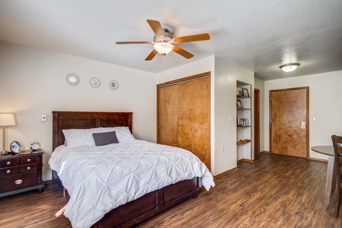 Bedroom with large bed and end table with lamp at Marcy Place in Big Spring, Texas