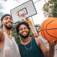 Residents playing basket ball at The Nathaniel in Rochester, New York