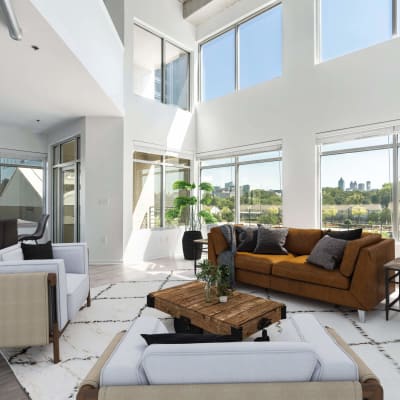 Gorgeous living room with tall ceilings at 17th Street Lofts in Atlanta, Georgia