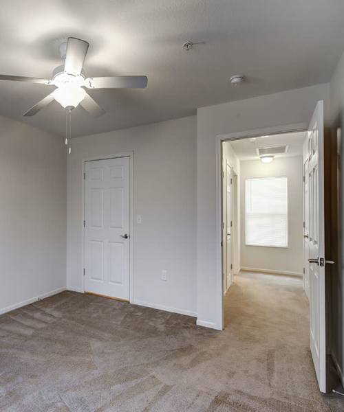 Unfurnished bedroom with a ceiling fan at Saluda Commons in Saluda, South Carolina