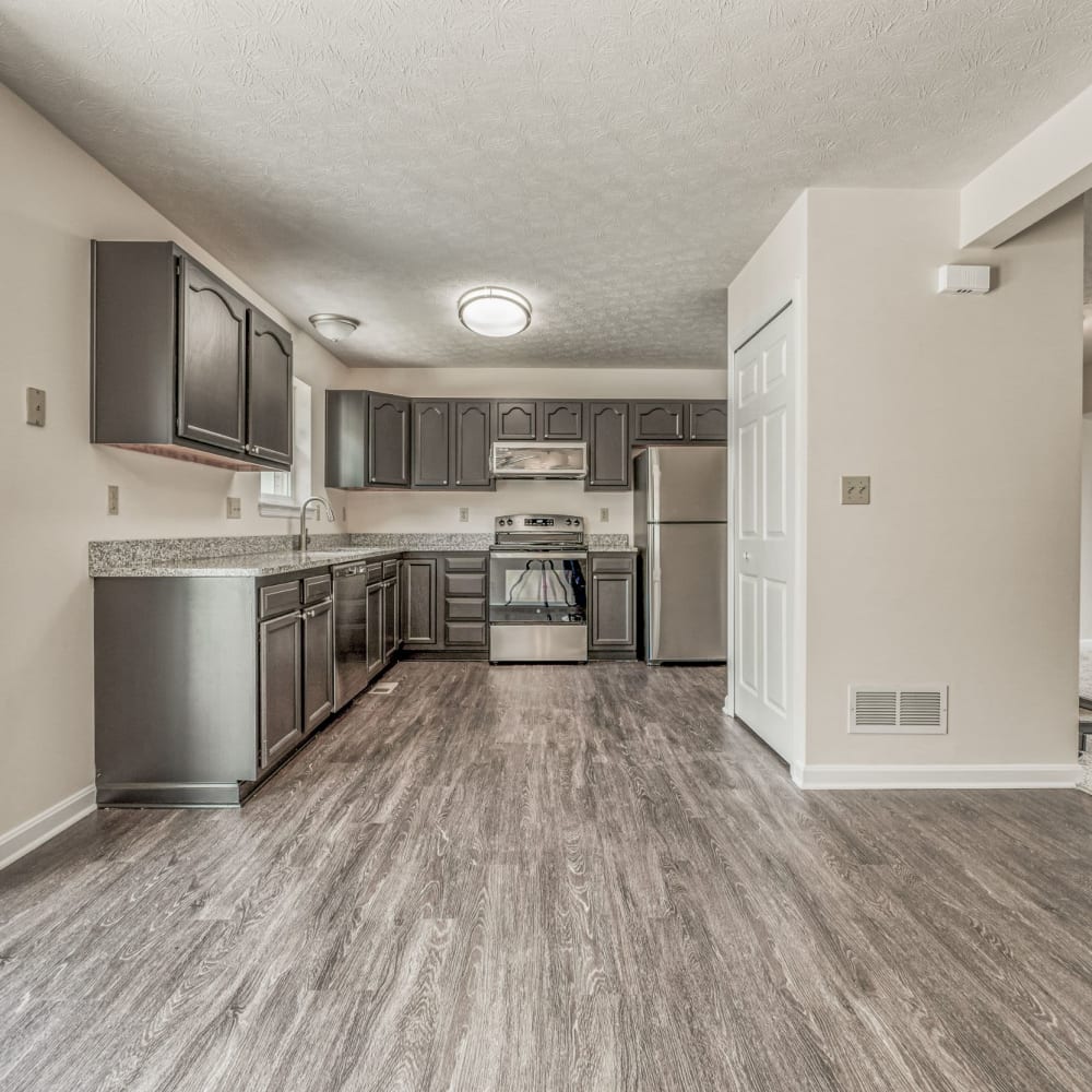 Kitchen with wood-style flooring at Walton Crossings, Jeannette, Pennsylvania