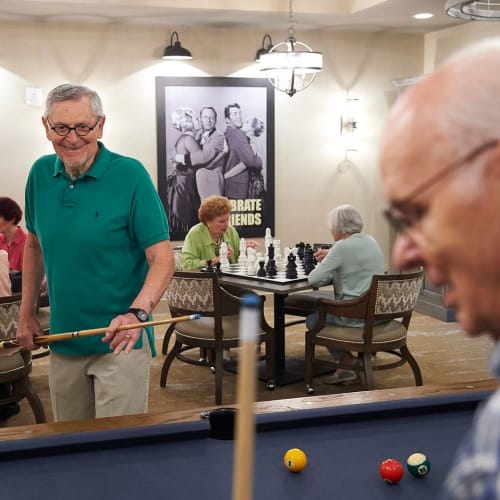 Residents playing pool at Celebration Village Acworth in Acworth, Georgia