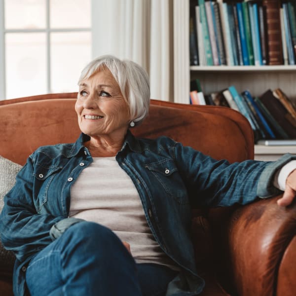 A resident relaxing in her chair at Pacifica Senior Living Menifee in Sun City, California.