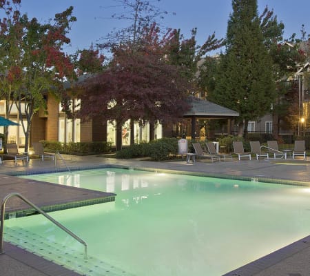 Beautiful swimming pool as dusk in Cortland Village Apartment Homes in Hillsboro, Oregon