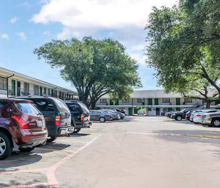 Community view with parking space at The Court at Oak Forest in Houston, Texas
