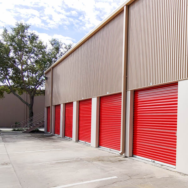 Red doors on outdoor units at StorQuest Self Storage in Tampa, Florida