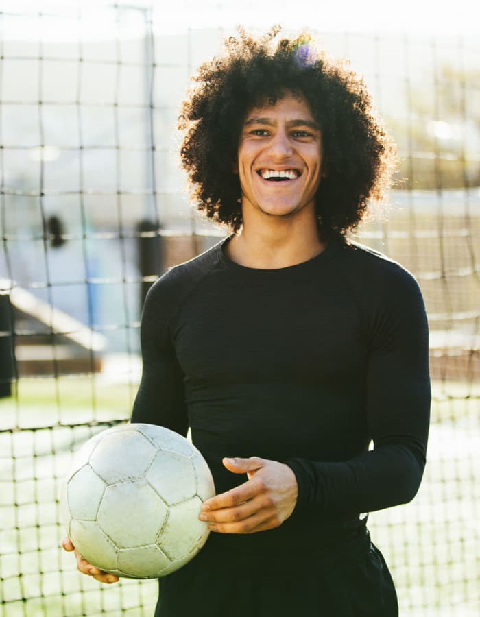 Student playing soccer near Tower 5040 in Houston, Texas