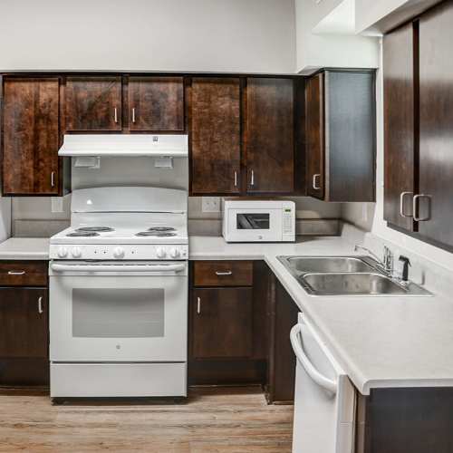 Model home kitchen with appliances at Bell Diamond Manor in Norfolk, Virginia