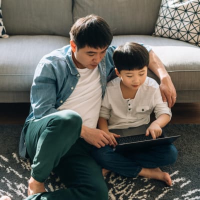 Resident enjoying time with his son at The Villas at Woodland Hills in Woodland Hills, California