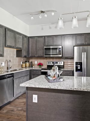 Gourmet kitchen with island seating at Shannon Creek in Burleson, Texas