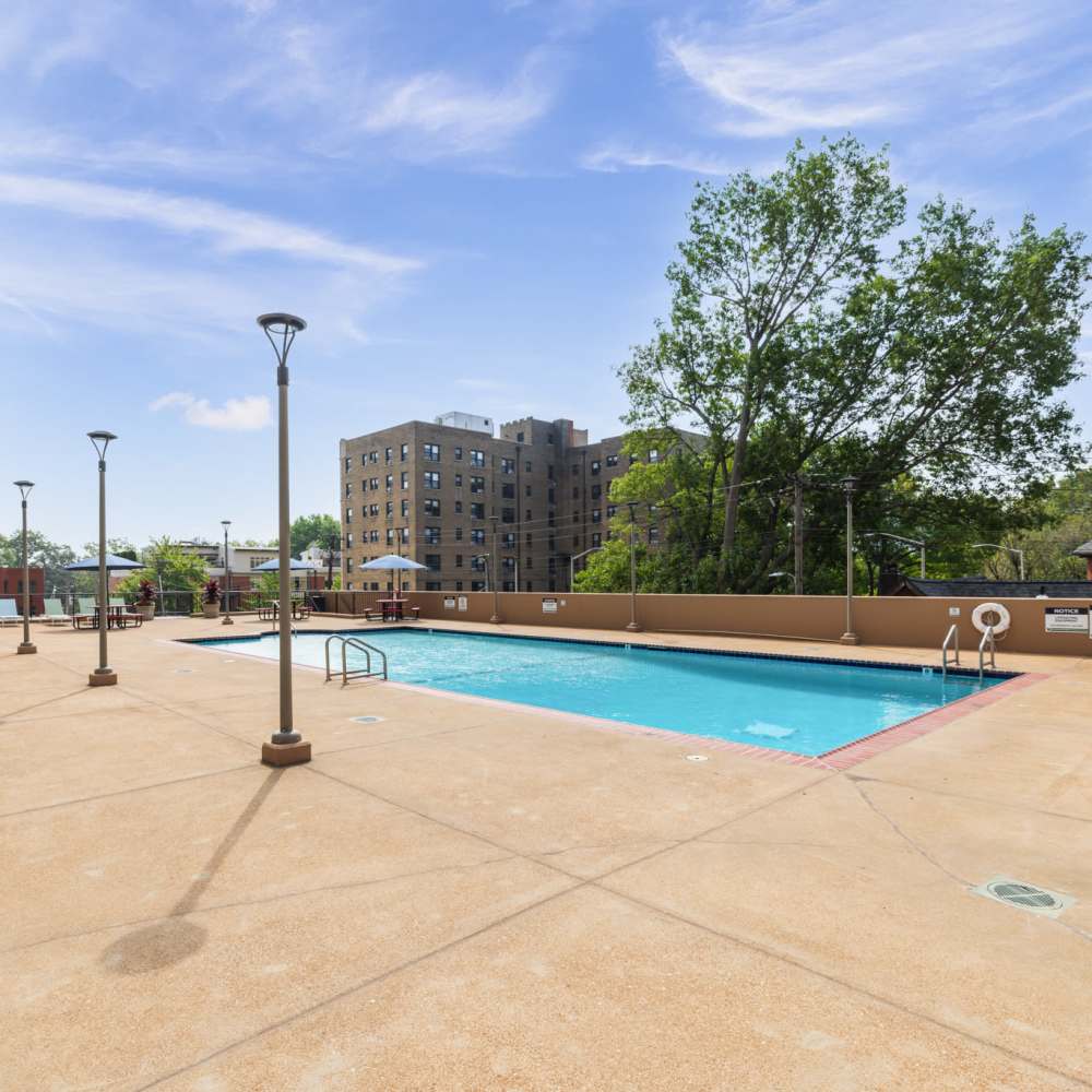 Sparkling water pool with inviting lounge areas at The View at Forest Park in St. Louis, Missouri.