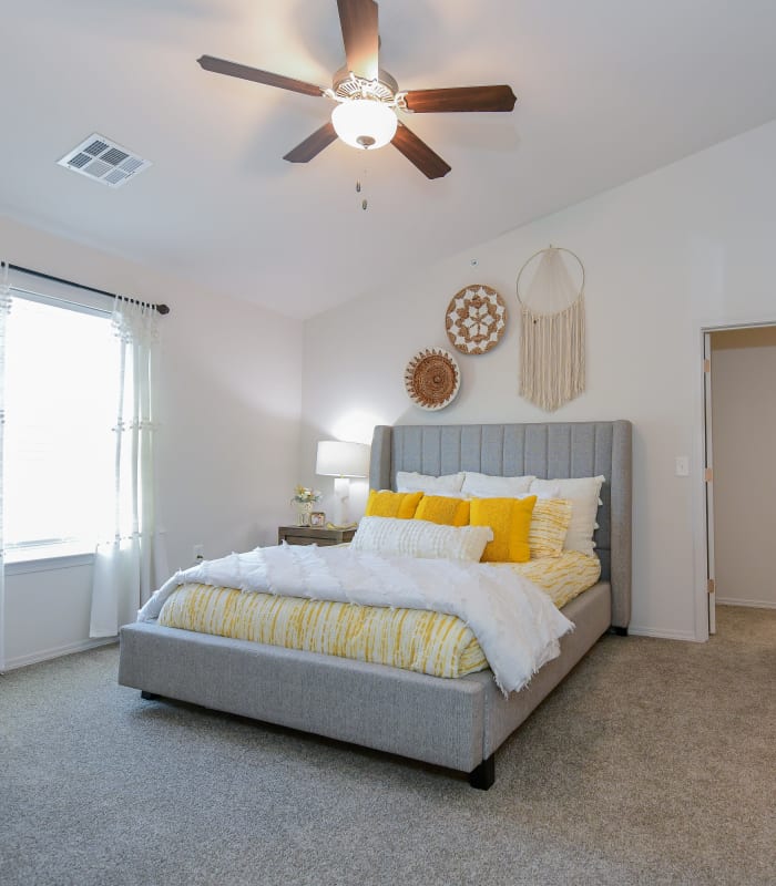 Chic bedroom with ceiling fan at 97@ North Oak in Kansas City, Missouri