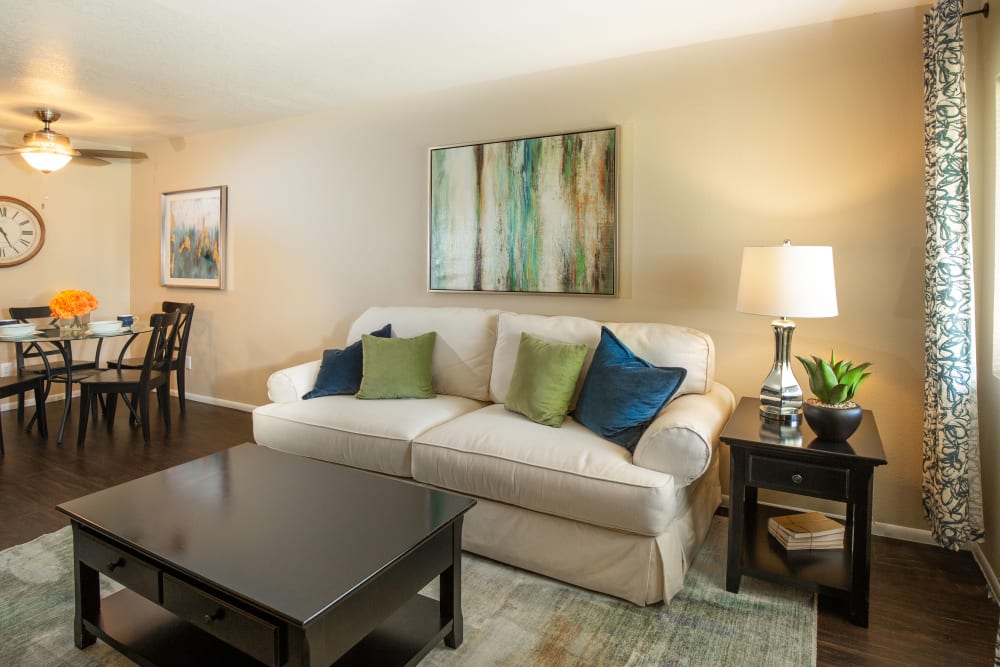 A cozy apartment living room with a love seat at Callaway Apartments in Taylorsville, Utah