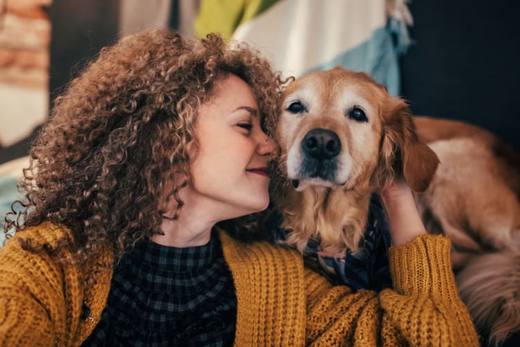 Resident and her dog loving their new home at Premier Apartments in Austell, Georgia