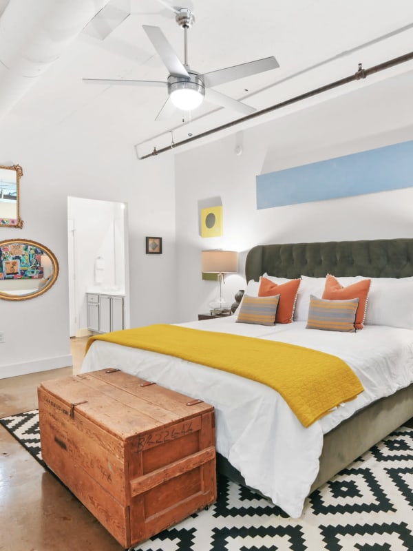 Bedroom with ceiling fan at South Side on Lamar in Dallas, Texas
