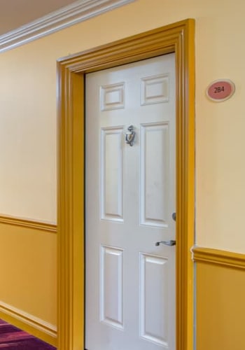 Front door of Ocean Harbor Apartments in Belmar, New Jersey