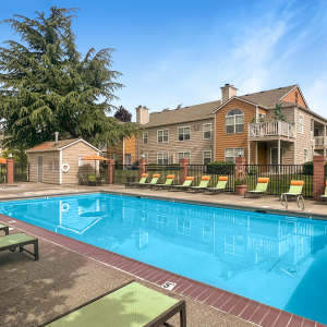 Swimming pool area at Carriage Park Apartments in Vancouver, Washington