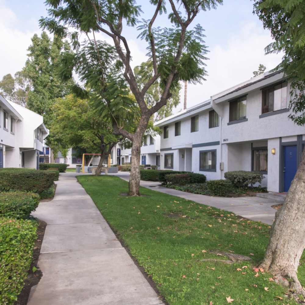 Community with trees at Fairvalley Villa in Covina, California  