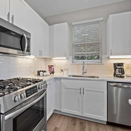 Bright kitchen with stainless steel appliances at Magnolia Heights in Charlotte, North Carolina