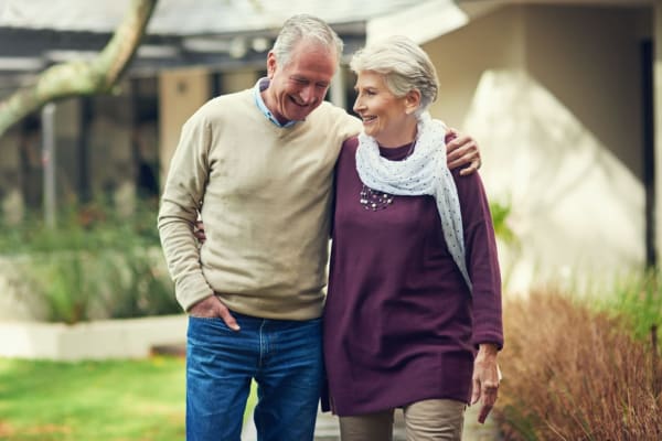 A senior couple walking together at Bayberry Commons in Springfield, Oregon