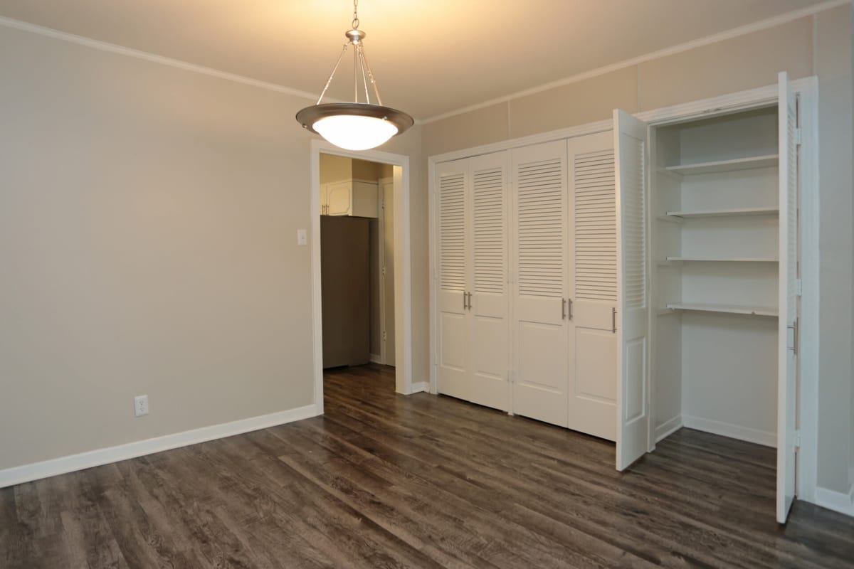 Wood-style flooring in an apartment bedroom at Tanglewood in San Antonio, Texas