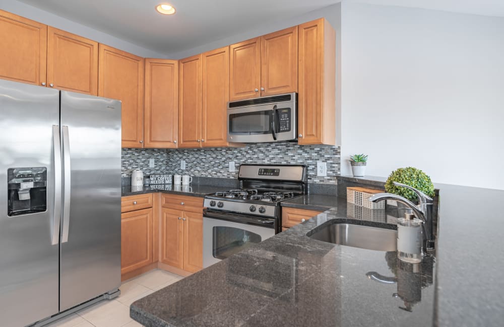 Fully equipped kitchen in a home at Cranford Crossing Apartment Homes in Cranford, New Jersey