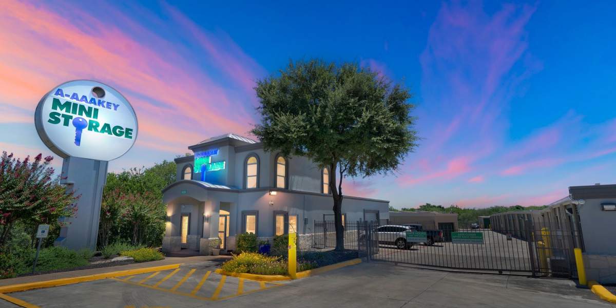 Woman working on her laptop and packaging boxes by the side at Storage Hub - Grissom & Tezel in San Antonio,Texas