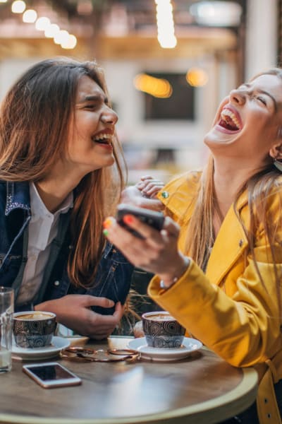 Residents laugh and enjoy coffee near Volta on Broadway, Tempe, Arizona