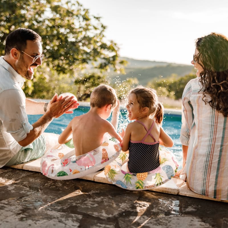 Family playing at the pool at Attain at Towne Centre, Fredericksburg, Virginia
