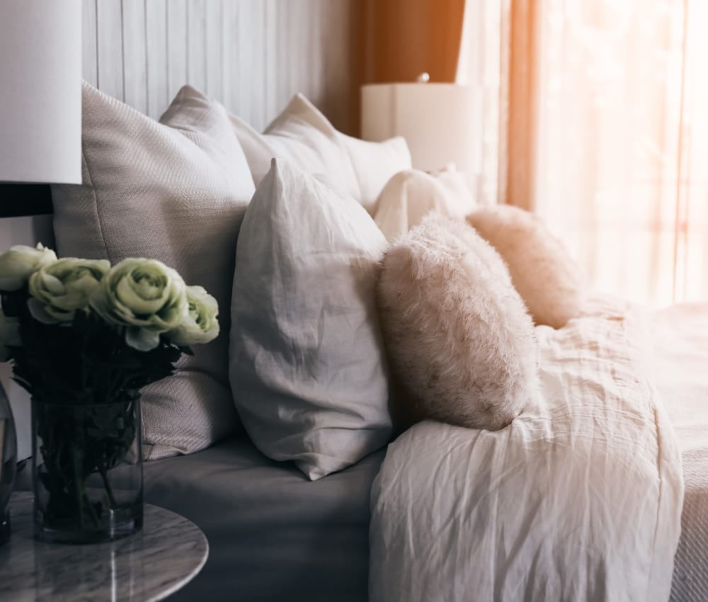 Pillows on bed in master bedroom at The Cascades Senior Apartments in Cumberland, Maryland