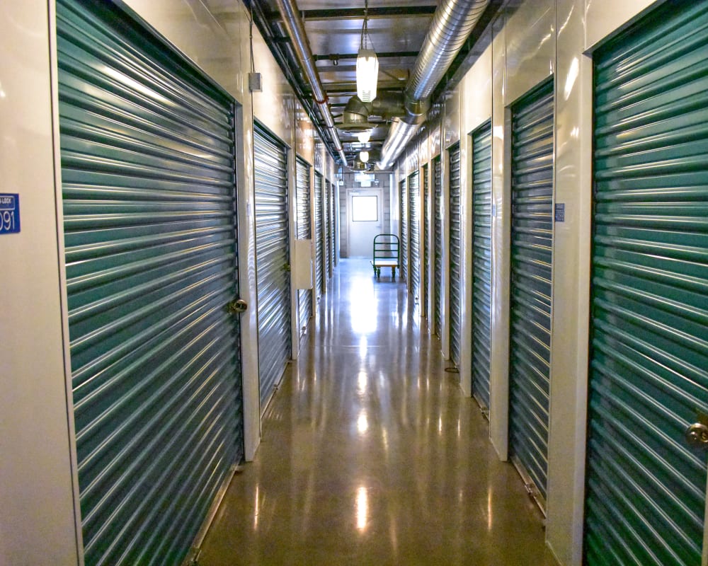 Green doors on interior climate-controlled storage units at STOR-N-LOCK Self Storage in Redlands, California