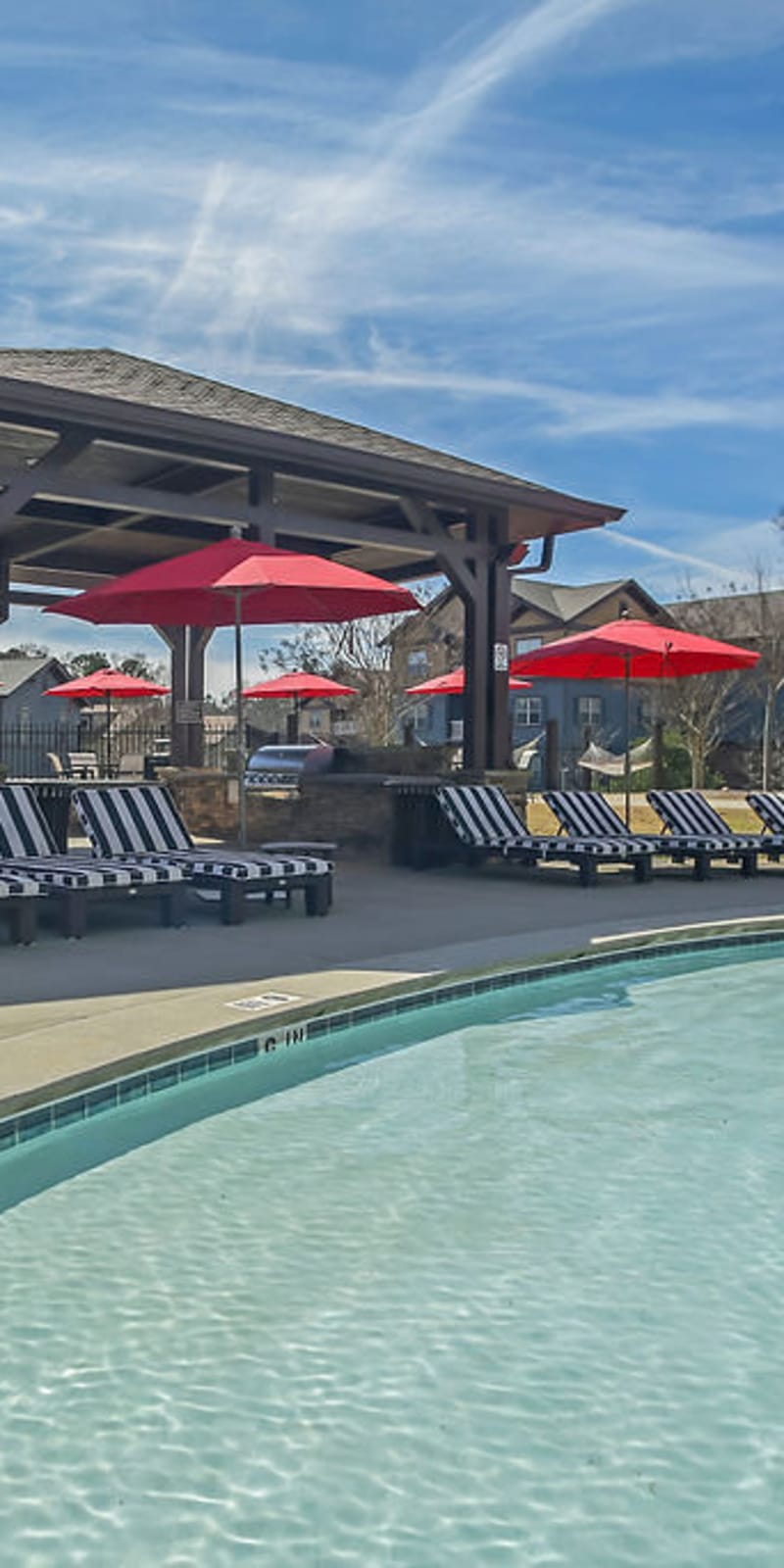 Resort-style swimming pool and lounge chairs at West 22 in Kennesaw, Georgia