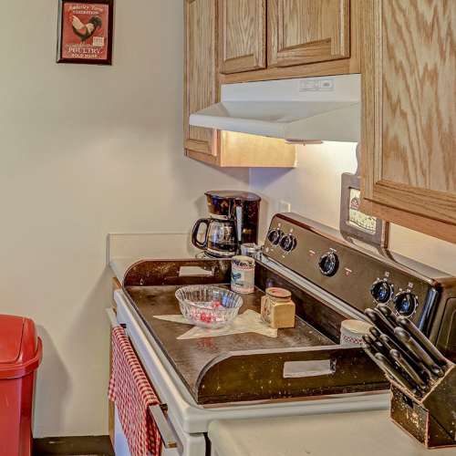 Kitchen with oak cabinets and stainless steel appliances at Glennview Apartments in Washington Court House, Ohio