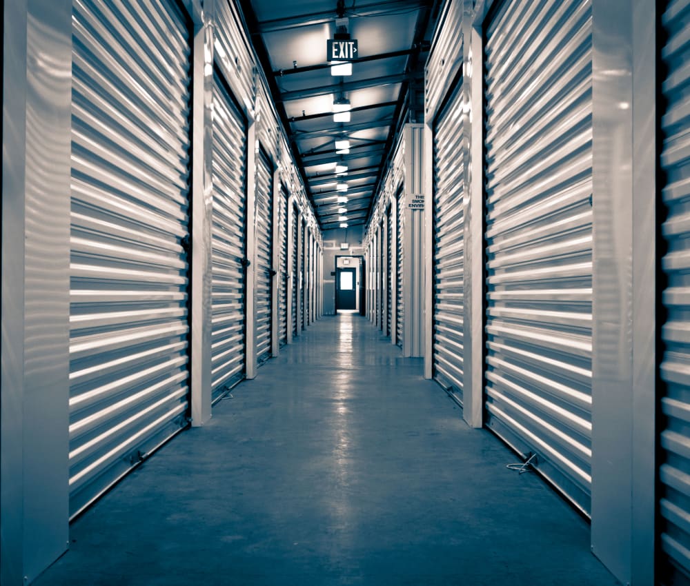 Row of indoor storage units at Store It All Self Storage - Del Norte in Laredo, Texas