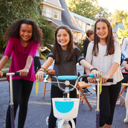 Resident children riding scooters at an event at Bellevue in Washington, District of Columbia