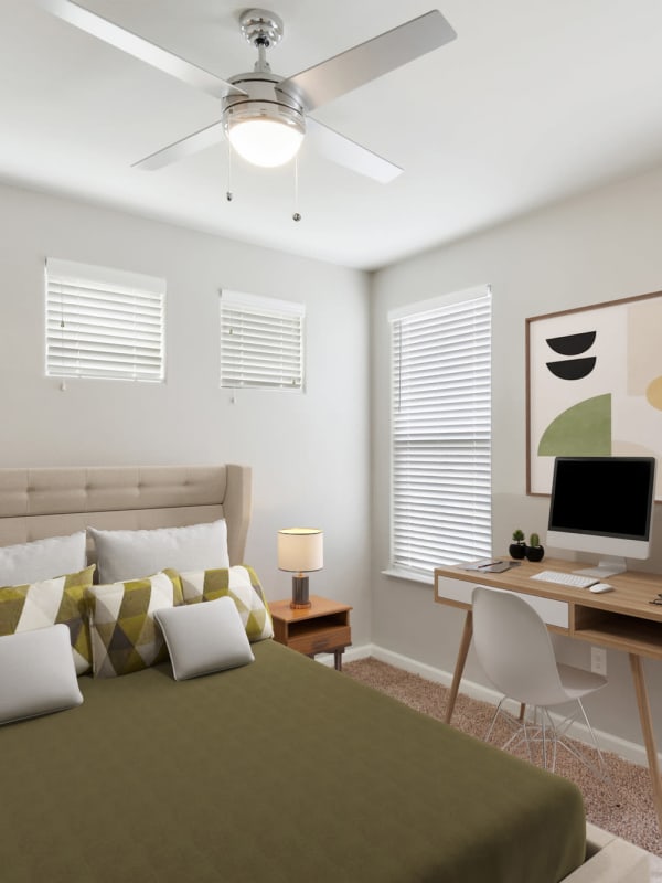 Bedroom with ceiling fan at Lantower Edgewater in Pflugerville, Texas