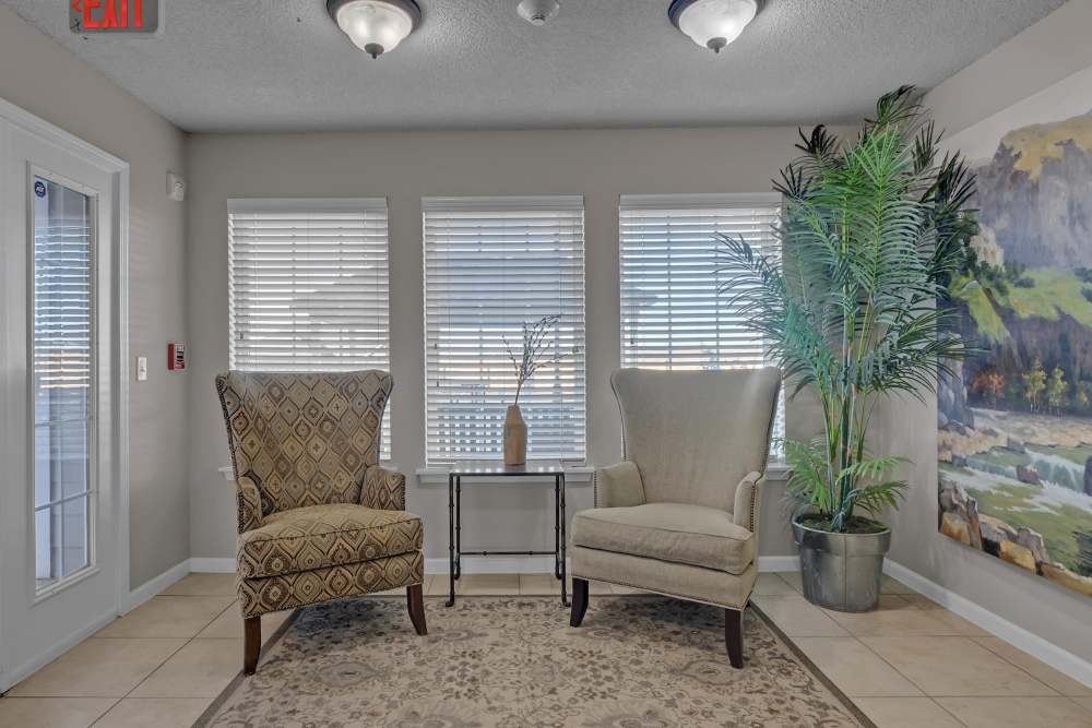 Common seating area with chairs at River Ridge in Sand Springs, Oklahoma