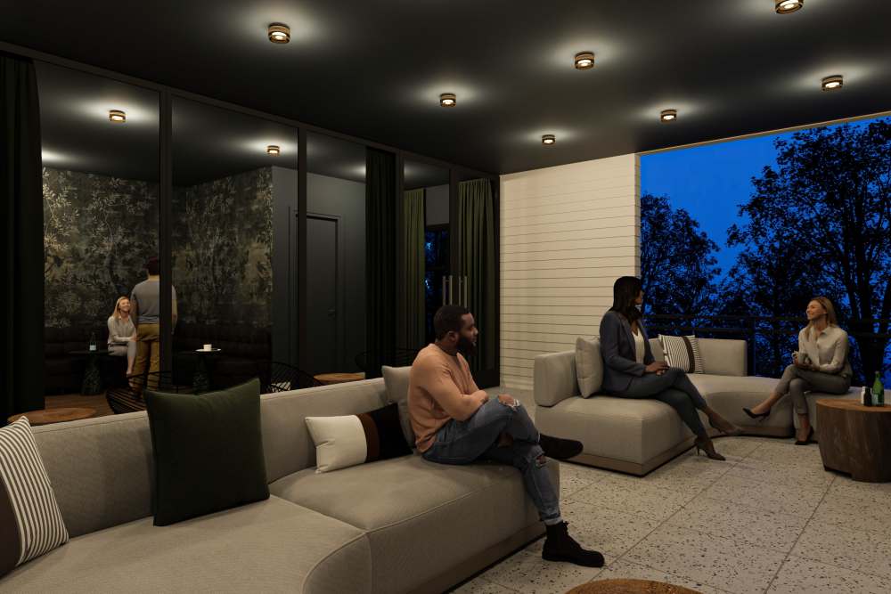 Community seating area with couch and ambient lighting at St. Albans Lofts in Raleigh, North Carolina,