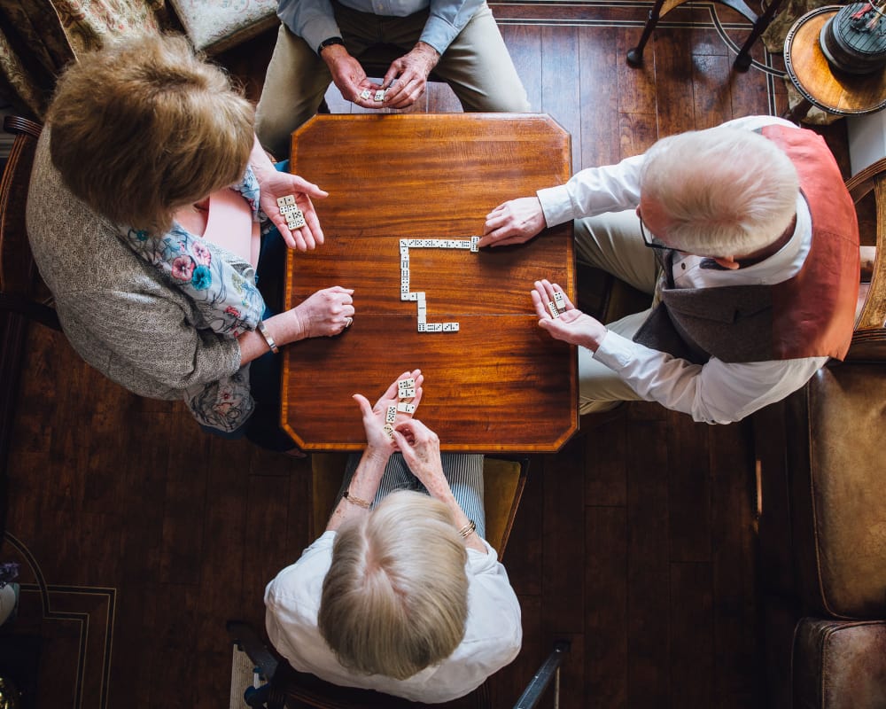 Residents playing dominoes at The Gardens at Creekside