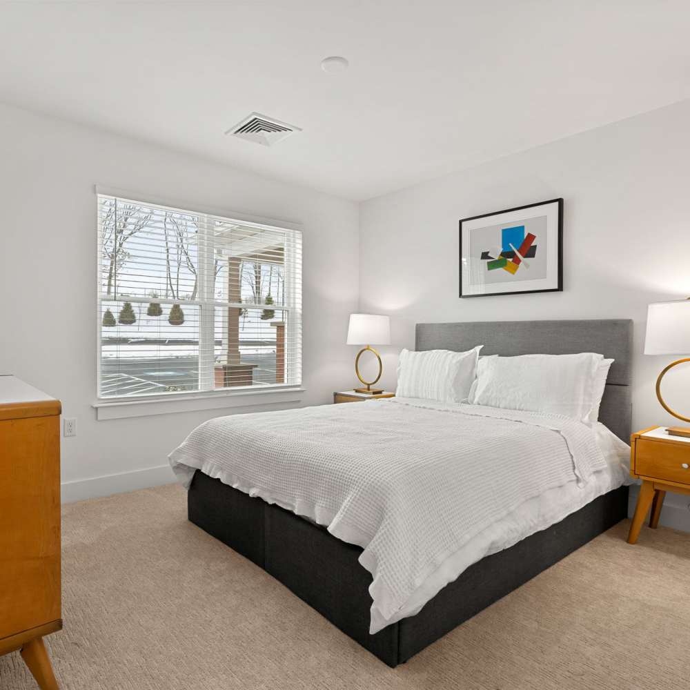 Bedroom with window at Henrietta Place in Rochester. NY