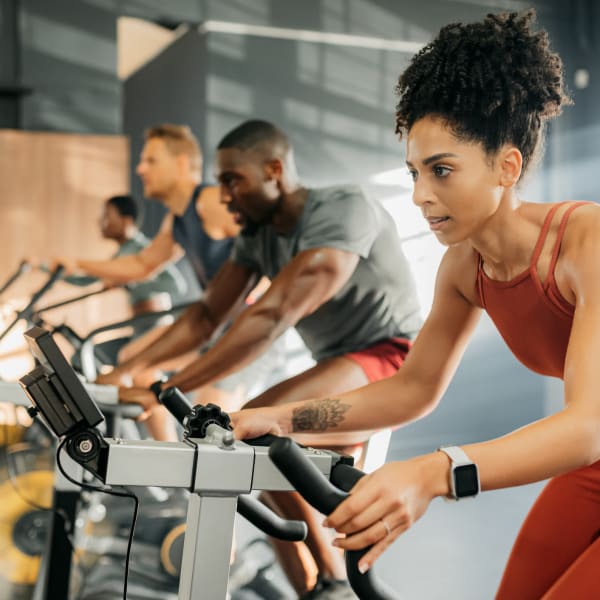 Residents in fitness center at The Quarters at Iowa City in Iowa City, Iowa