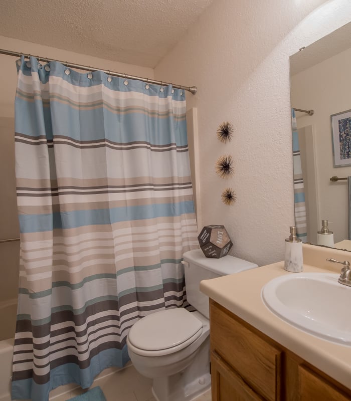 Bathroom with tile flooring at The Warrington Apartments in Oklahoma City, Oklahoma