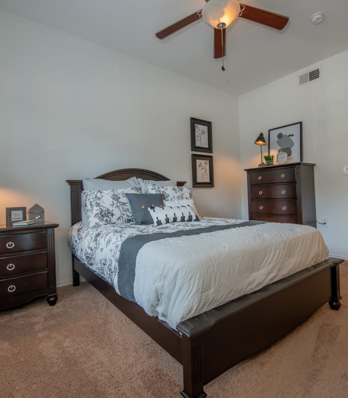 Chic bedroom with ceiling fan at The Pointe of Ridgeland in Ridgeland, Mississippi