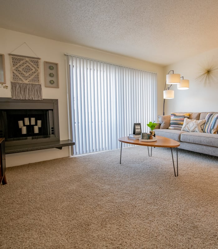 Spacious living room with large windows at Council Place Apartments in Oklahoma City, Oklahoma