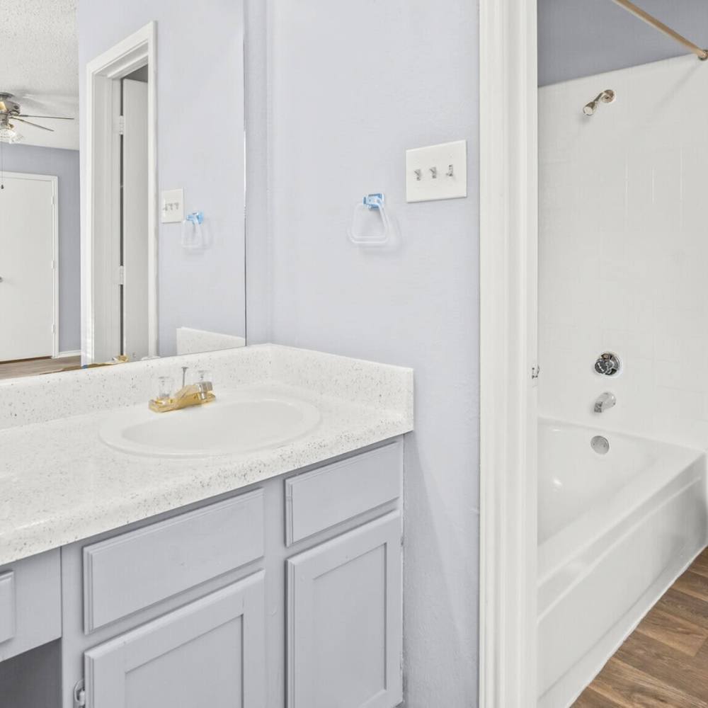 Bathroom attached to bedroom at North Hills Place in Richland Hills, Texas