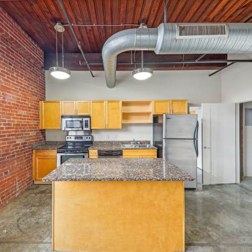 Kitchen withh granite countertop at Stadium Loft Apartments in Saint Louis, Missouri